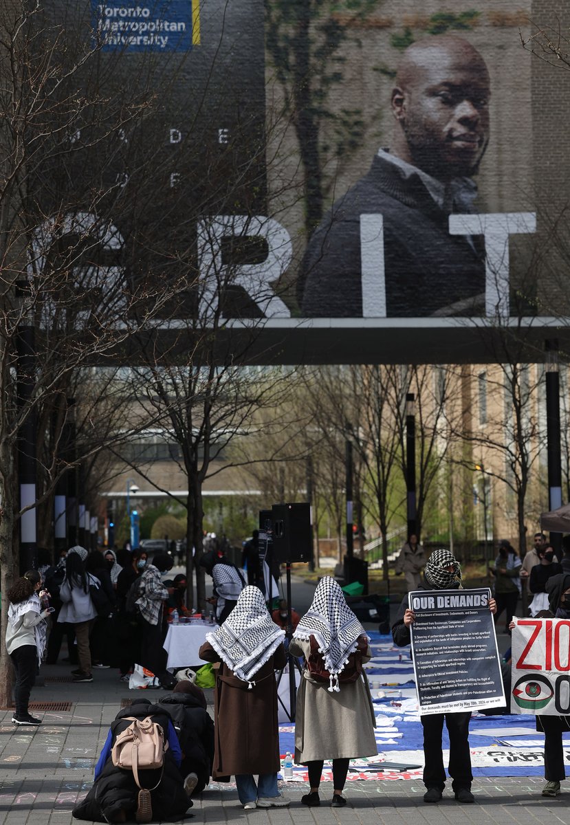 Toronto Metropolitan University students protest outside demanding that the University divest from any investments in companies that arm or produce arms for Israel.