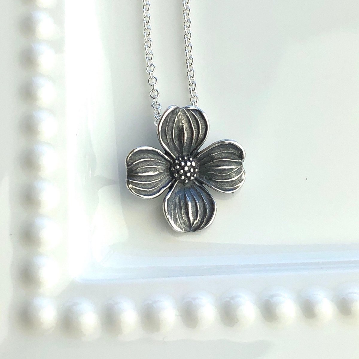 This sweet Dogwood Bloom pendant is available in my shop. carrienunes.etsy.com/listing/774803… #dogwood