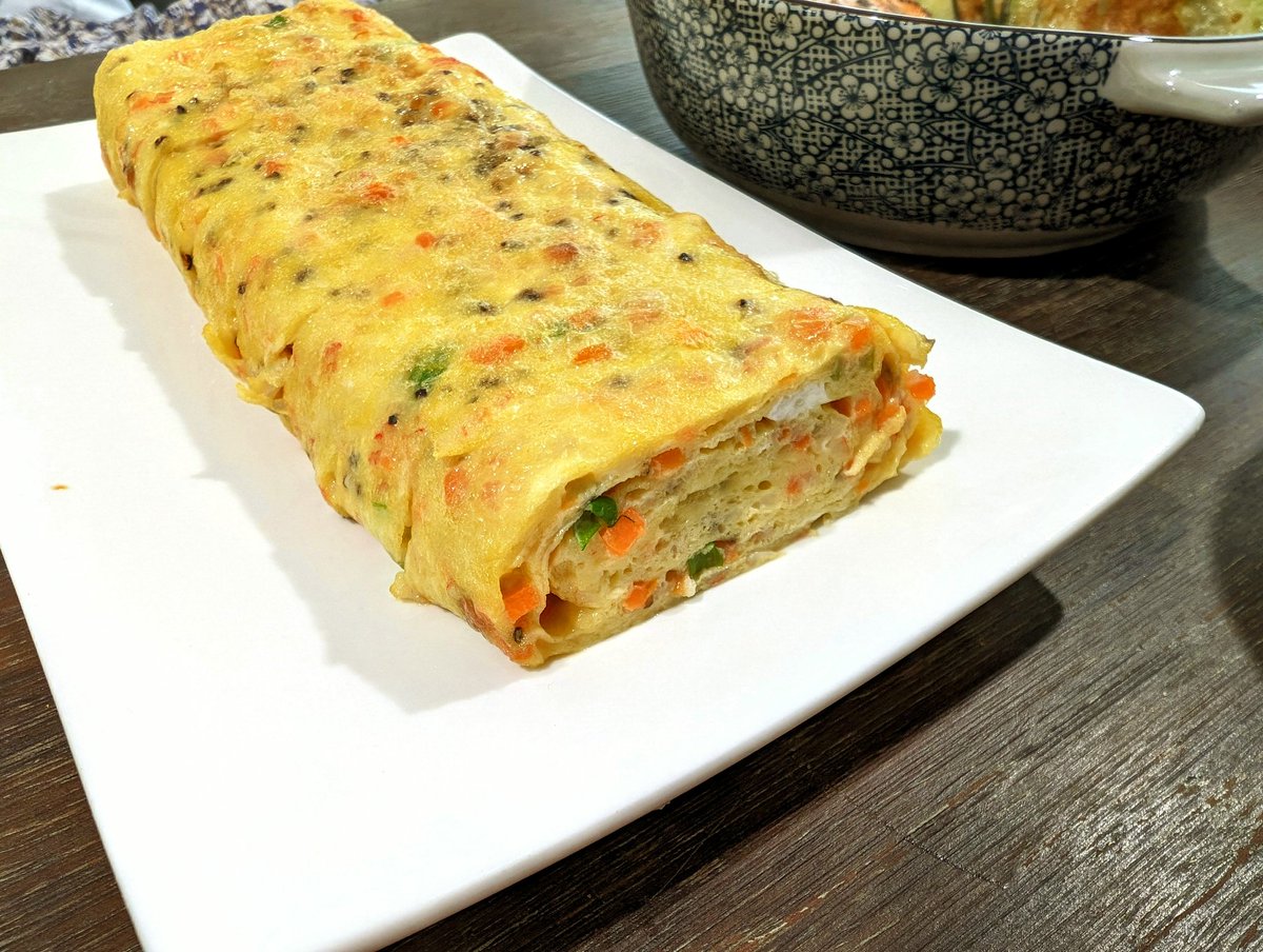 Korean egg roll omelette, salmon, zucchini jeon, gochujang squid, seaweed and beansprouts
