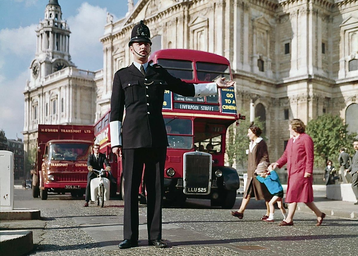 A traffic policeman at work near to St Paul’s Cathedral. London, 1960s.