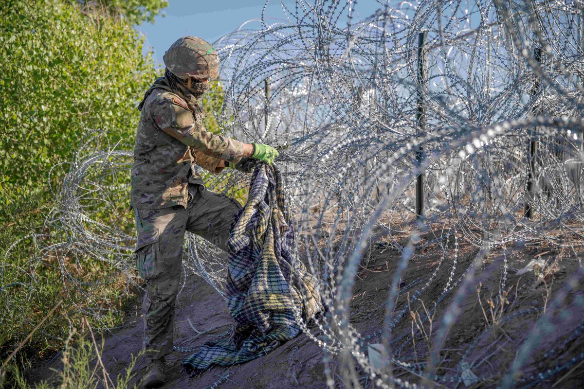EL PASO, Texas -- A Texas National Guard Soldier removes debris and repairs anti-climb barrier to prevent illegal border crossers' entry into the US. #OperationLoneStar