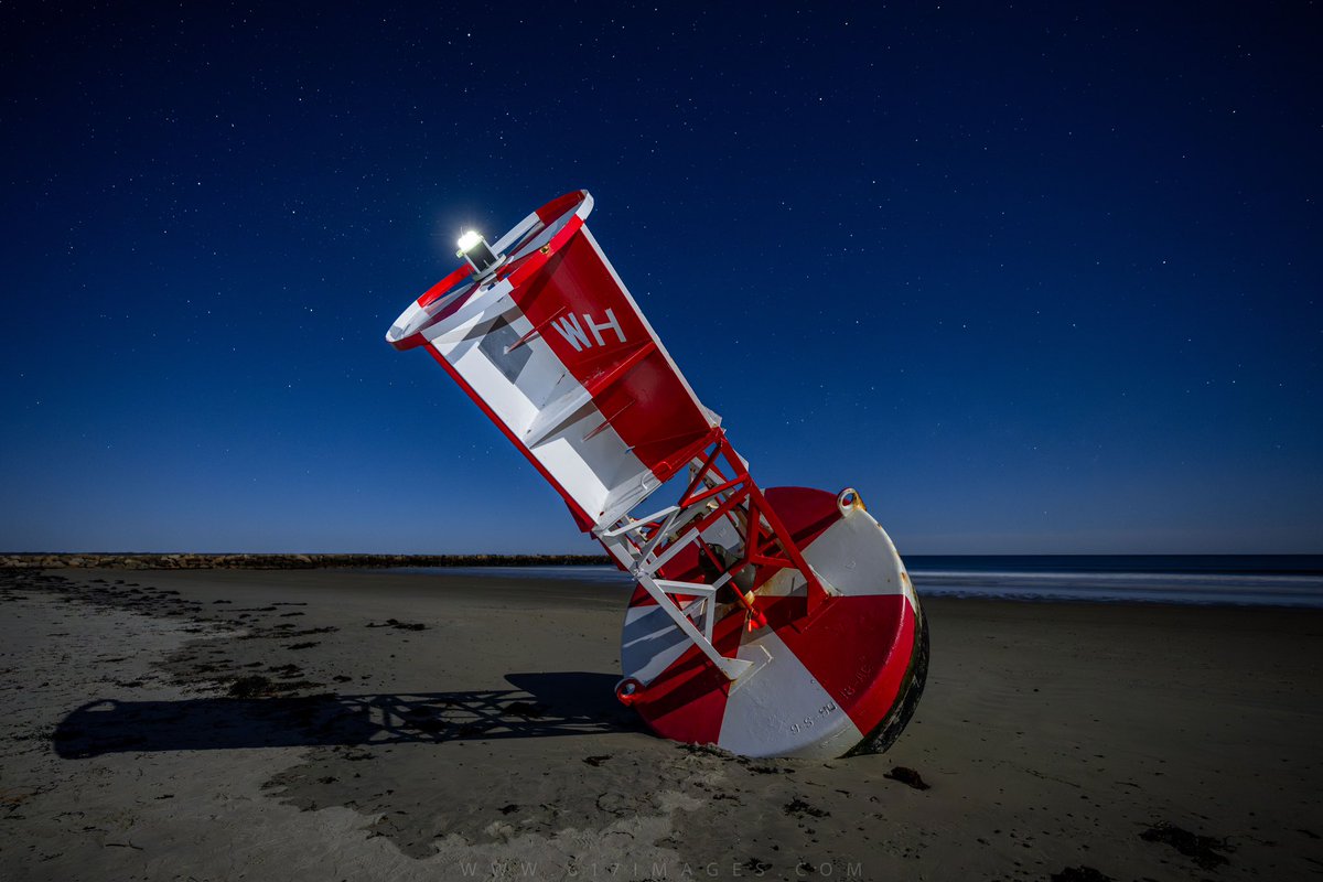 🌊 Captured another mesmerizing moment on Wells Beach, Maine! 📸 This time, a washed up Wells Harbor safety buoy under the enchanting glow of a near full moon. 🌕 Spent over 3 hours perfecting the shot in the early morning hours, but the result was worth every minute. 🌌 Adding