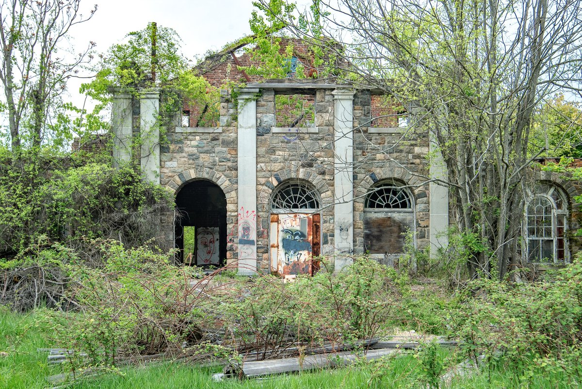 A ruined and collapsing dormitory at the long abandoned Letchworth Village Psychiatric Hospital in New York.