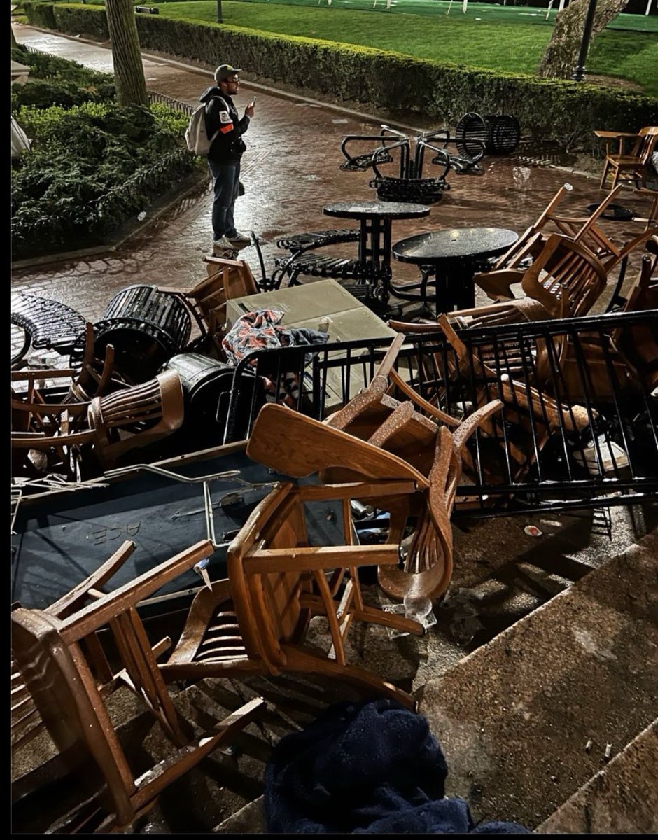 Broken tables and chairs left by NYPD officers outside of Hind’s Hall at Columbia University.