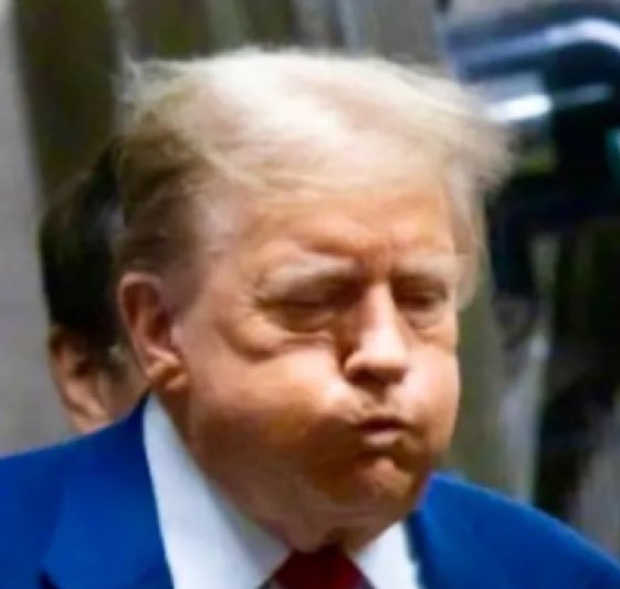 What does Trump have in his mouth?