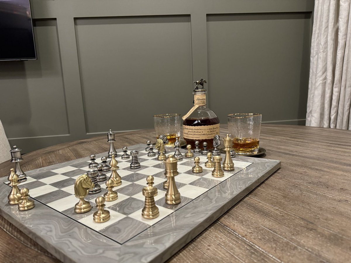 First night in the new house. Chess and a glass of ⁦@BlantonsBourbon⁩ with my son-in-law.