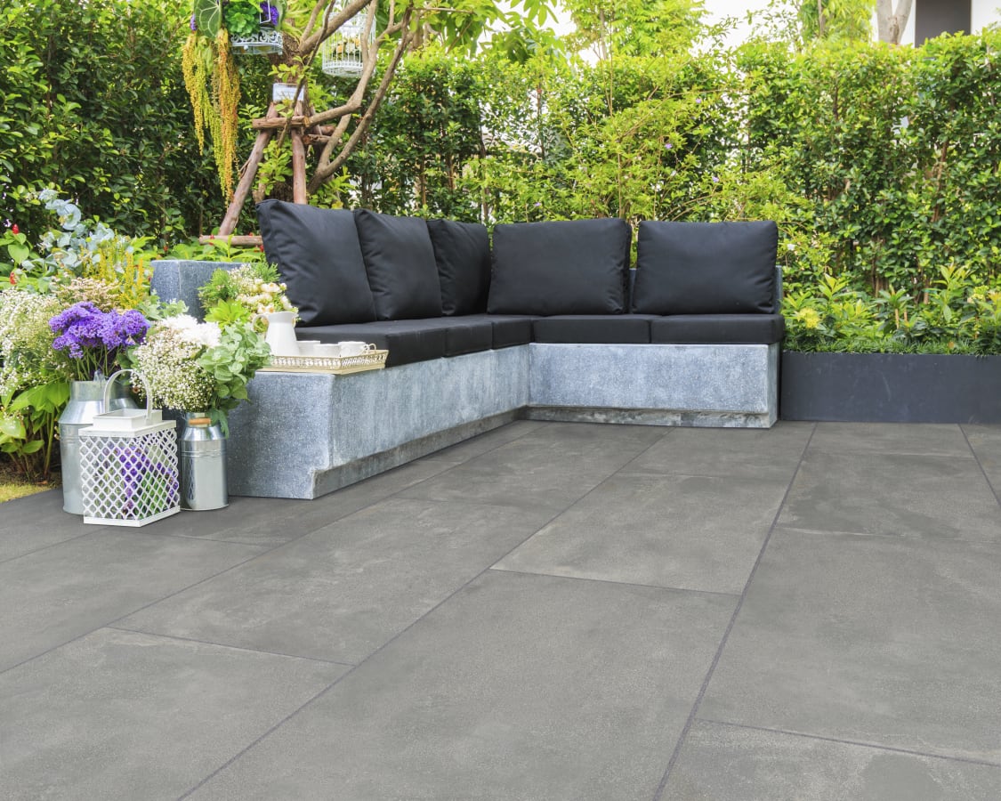 Transform your outdoor space with the simple yet stylish Ardara porcelain paving! Order now in branch and re-create that polished concrete look #landscaping #GardenInspiration #OutdoorLiving #marshallspaving #merrittandfryers #buildersmerchants #skipton #barnoldswick