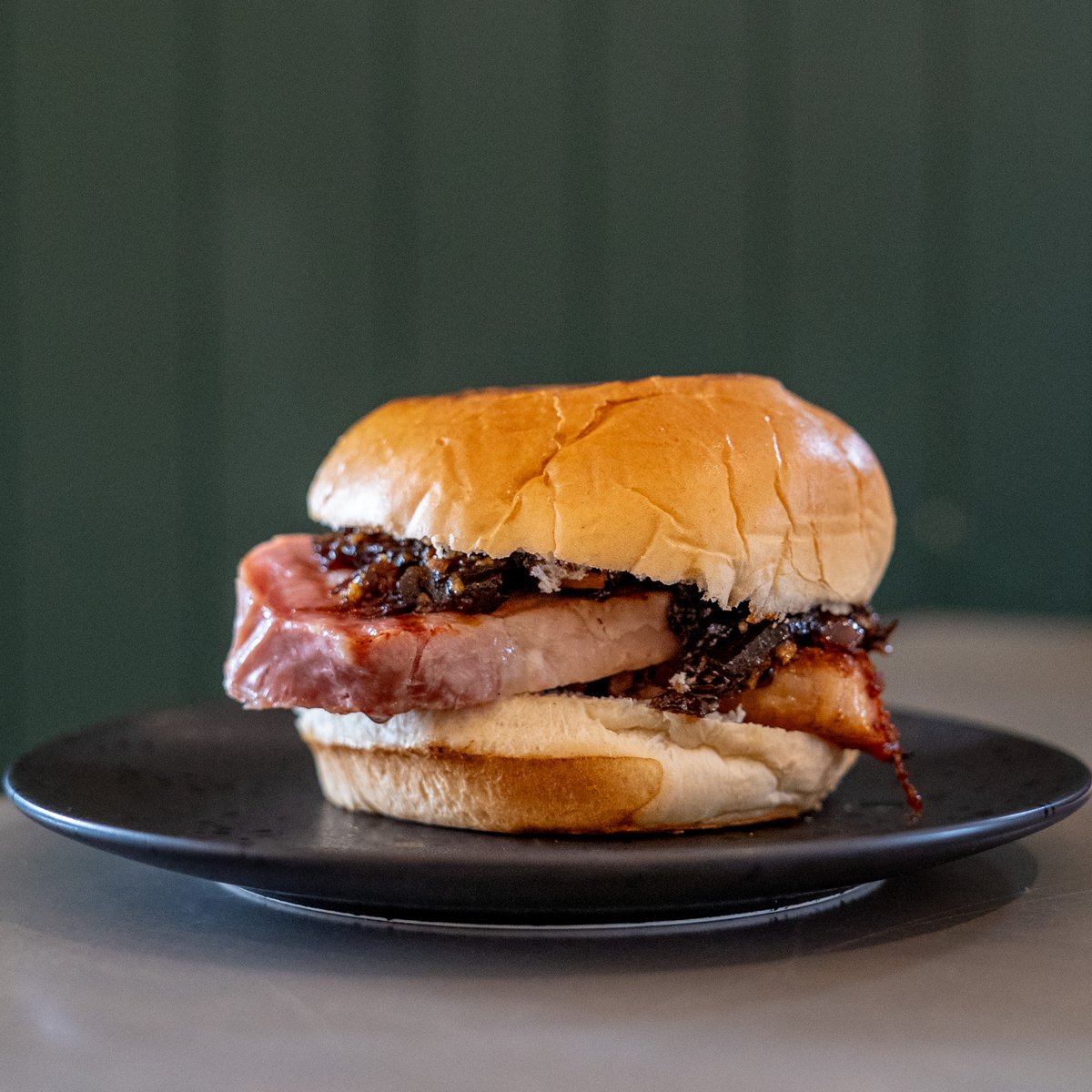 We do things a little differently here. Our Bacon Sandwich features a loin of pork sous vide and finished on BBQ, served on a toasted brioche bun and homemade relish.  
 
We wouldn't recommend having it every day, but life's too short not to indulge every once in a while.