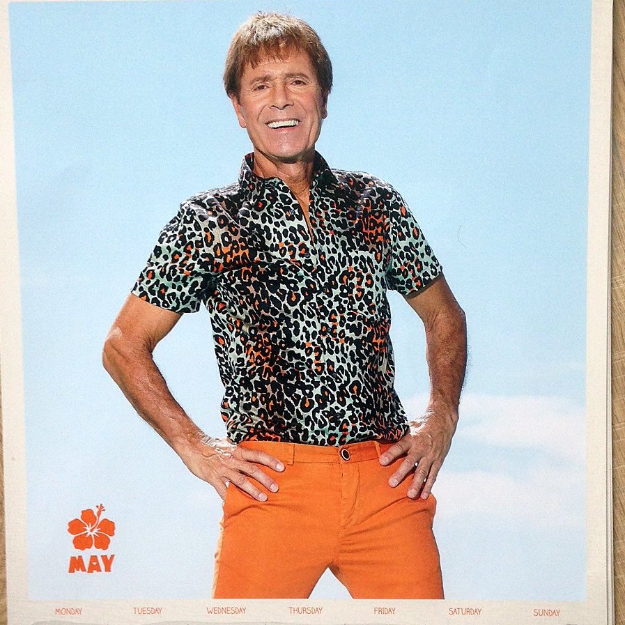 This month Cliff is wearing a silk leopard-print, short-sleeved shirt (Mr Byrite £17.99), accented in orange, and a pair of matching orange slim-fit, low-cut,deep-gusset chinos (Millets £24.95). Syrup by Alessandro of Crouch End (price on application). Happy May Day everyone.