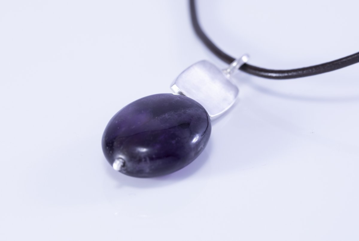 Sunning modern silver and oval shaped amethyst pendant with leather chain. For handmade, textured and hallmarked silver jewellery visit  margaretgriffithsilverjewellery.com #sterlingsilver #Margriff #earlybiz #FCworkspace #etsy