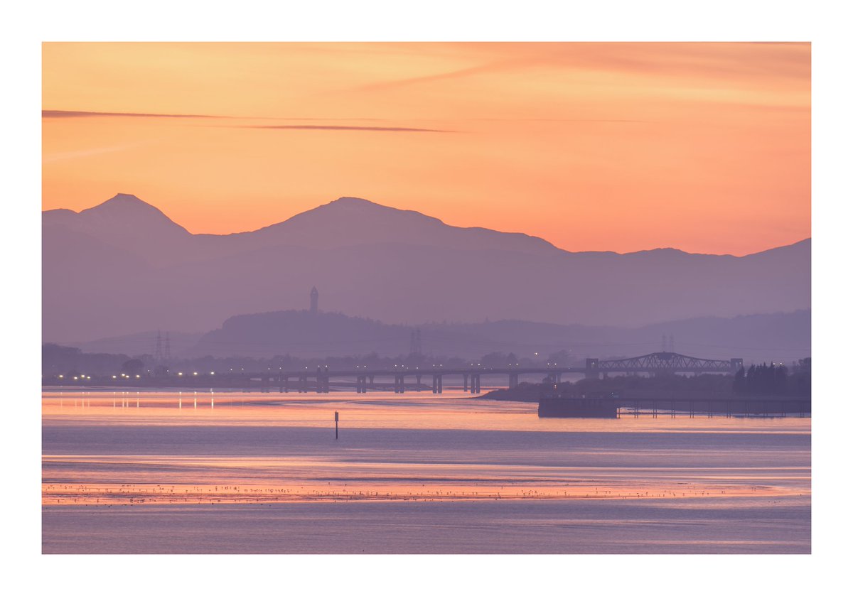 HAPPY VALLEY: An evening view up the Forth Valley at dusk towards Kincardine Bridge and the soft silhouette of the Wallace Monument against the hills. @fujilovemag @FujifilmUK @3LeggedThing #APPicoftheweek