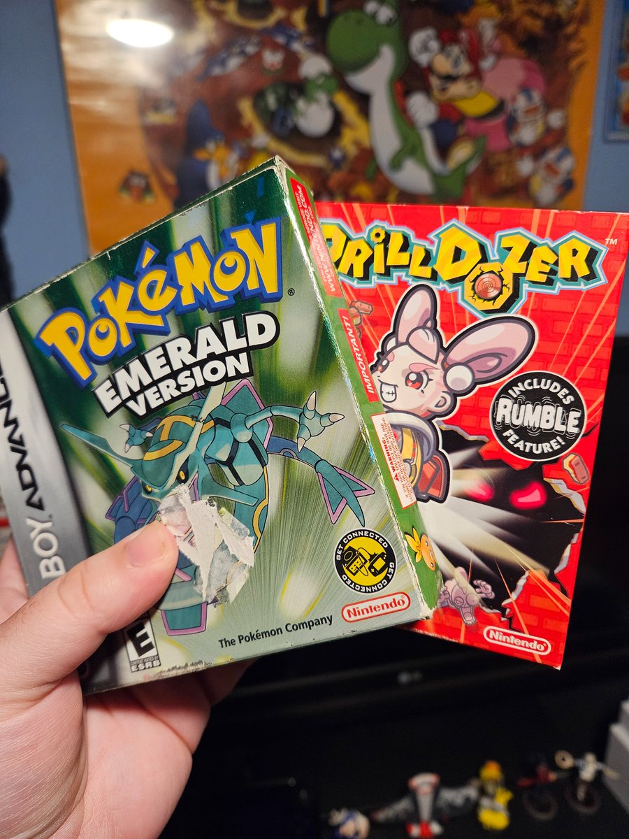 two of my most prized possessions are these copies of pokemon emerald and drill dozer

i wish the emerald box didn't have a stupid sticker slapped on the front, and the motor for the drill dozer cart no longer works, but i cherish them 🥹