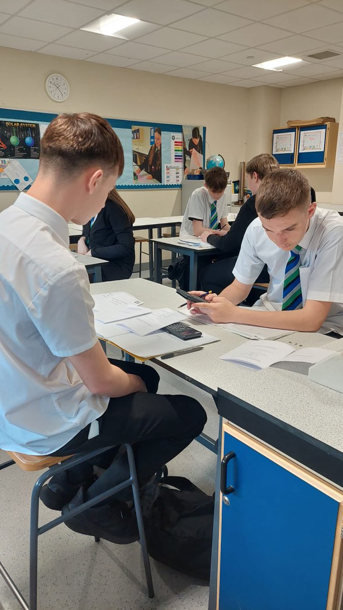 Mrs Biggins' S3 Physics class revising hard for their upcoming S3 exam, the pupils were speed dating exam style questions.