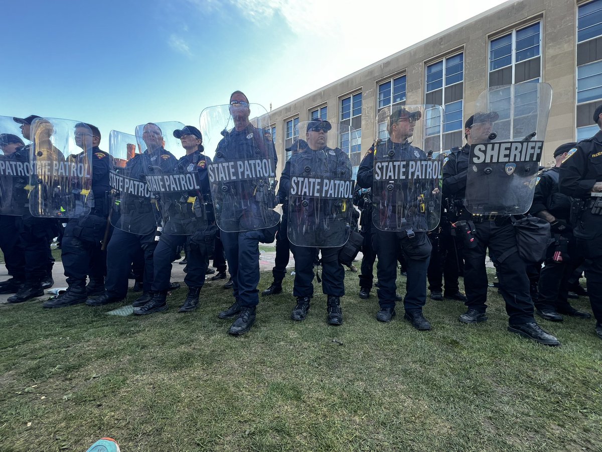 HANDS OFF OUR STUDENTS. I’m sitting in with my students & colleagues. This is my view from where I sit on the ground on Library Mall. If you are in Madison please come now and demand cops back down.