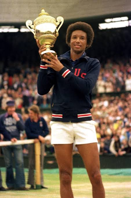 Arthur Ashe wearing his USA davis cup jacket during the 1975 wimbledon prize ceremony. He was the first black player to be selected in the US davis cup team and went on to win the men’s singles grand slams at Wimbledon, the US open and the Australian open.