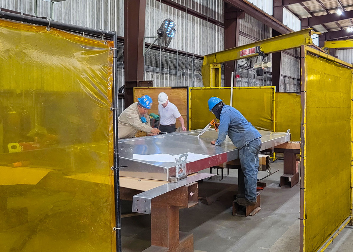 Our CEO is very proactive when it comes to quality assurance. Here, Mr. Egan inspects the assembly and weather sealing of a roof of a railroad hut.

#solutiondriven #steelfabrication #railroad #infrastructure #railstructure