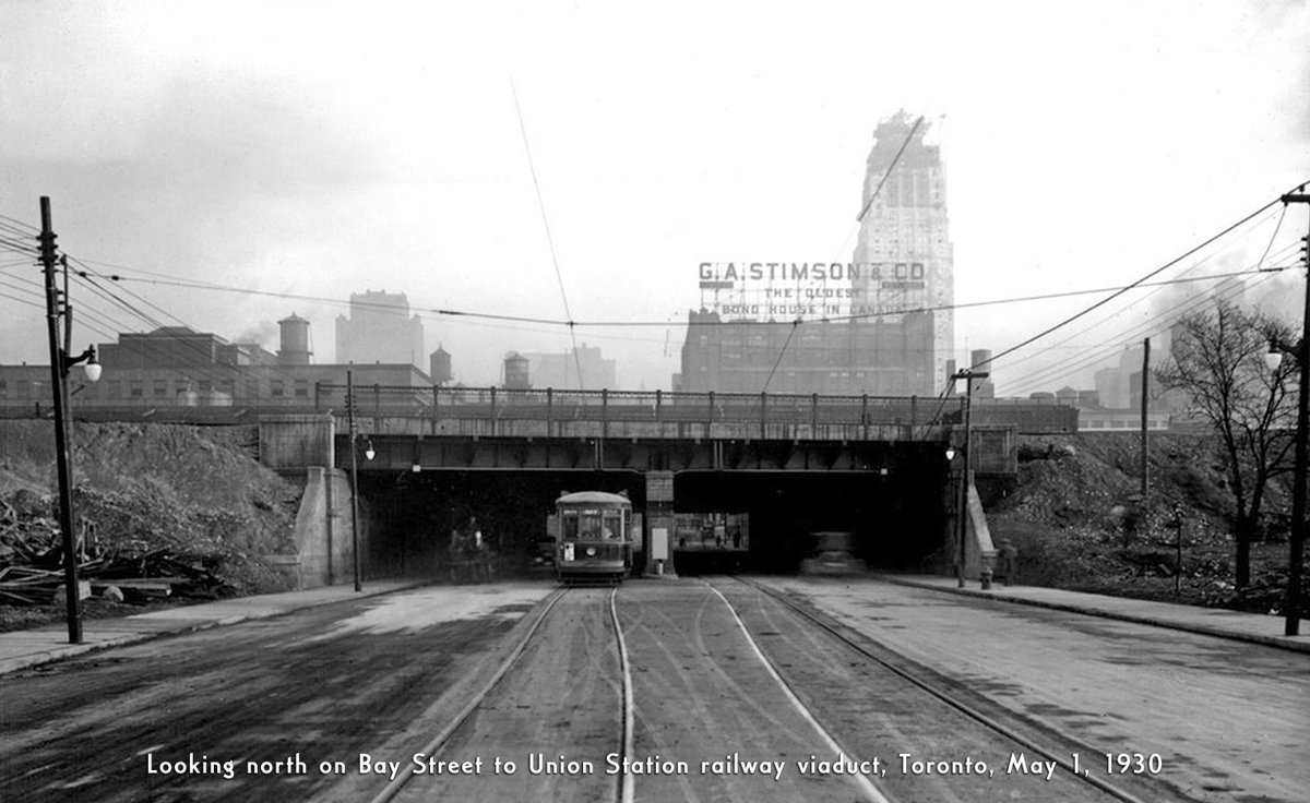 Views of Bay Street to the recently opened Union Station railway viaduct, Toronto, #OnThisDay 94 years ago - May 1, 1930. #otd #1930s #baystreet #railway #railroad #viaduct #streetcar #transit #history #torontohistory #tdot #the6ix #Toronto #Canada #hopkindesign