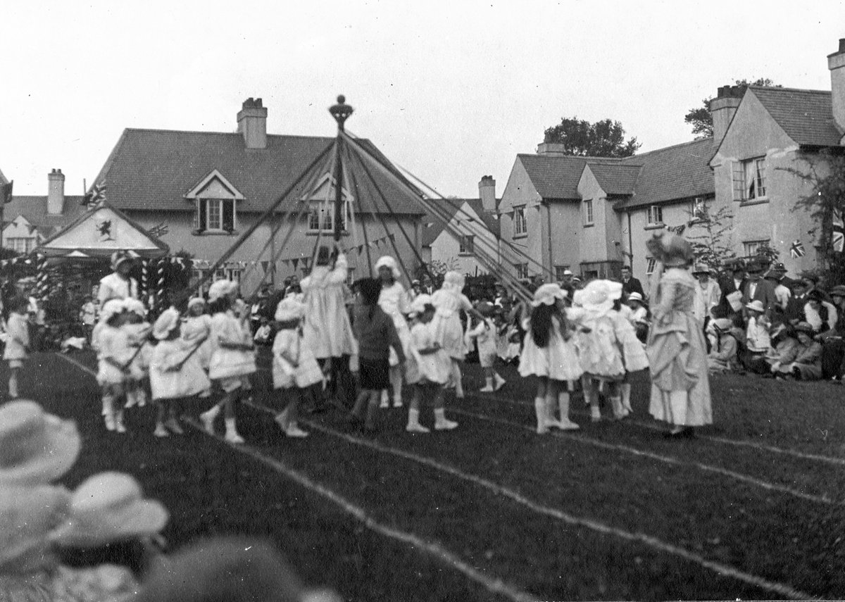 This photo shows May Day celebrations underway at #Rhiwbina Garden Village in #Cardiff Taken during the 1920s, it shows children dancing around the maypole. It comes from a series of photos showing festivals held at Rhiwbina.