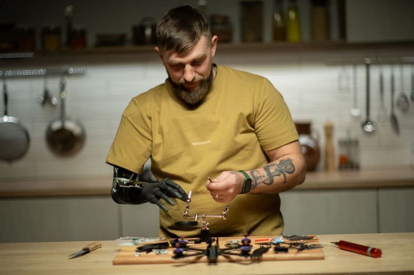 Ukrainian Defender Mykola Voronchuk lost his arm after a severe war injury. Now, he assembles drones with a bionic prosthesis.