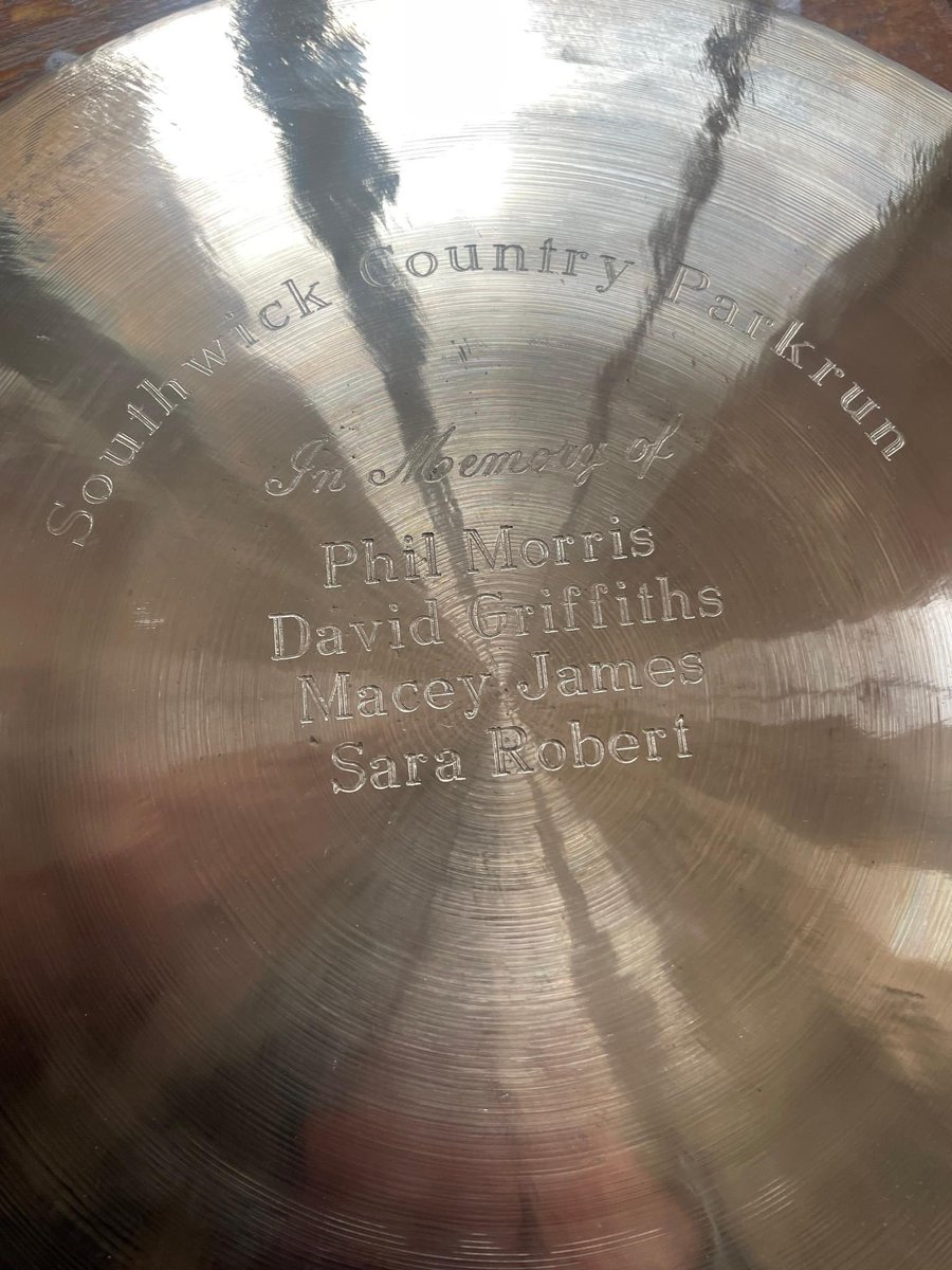Swickparkrun's tweet image. "The Gong" is back! We hang the Gong in a nearby tree at the finish area for people to hit if they have something to celebrate.  The Gong is a memorial Gong to those dearly departed upon it and is back from the engravers with the name of Sara Robert.