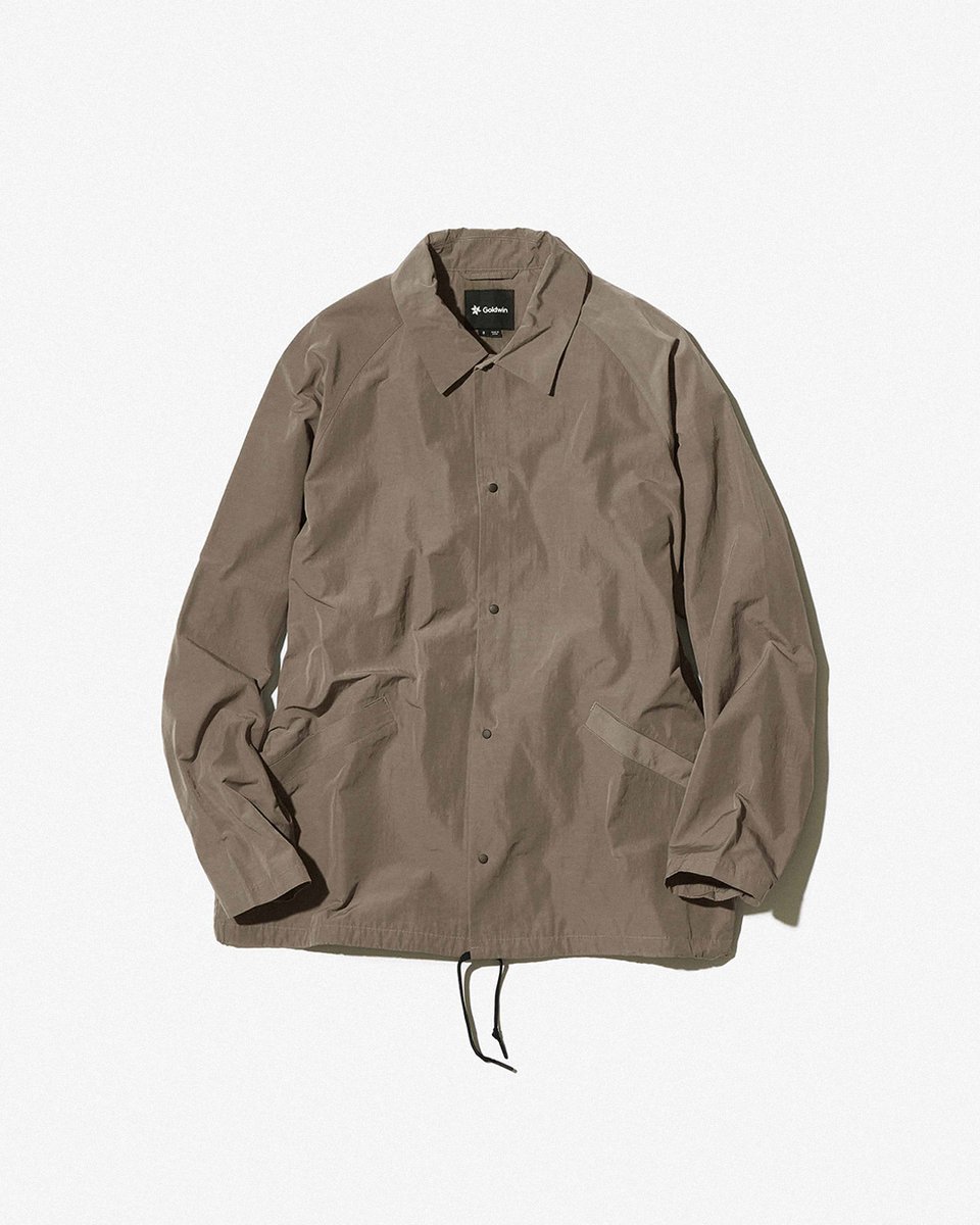 The Goldwin Nylon Coach Jacket in Taupe Gray embodies timeless style and eco-conscious innovation. Engineered from recycled nylon with a subtle sheen, it offers a seamless blend of function with sophistication. Shop now: yardsstore.com/collections/go… #yardsstore #yards #goldwin