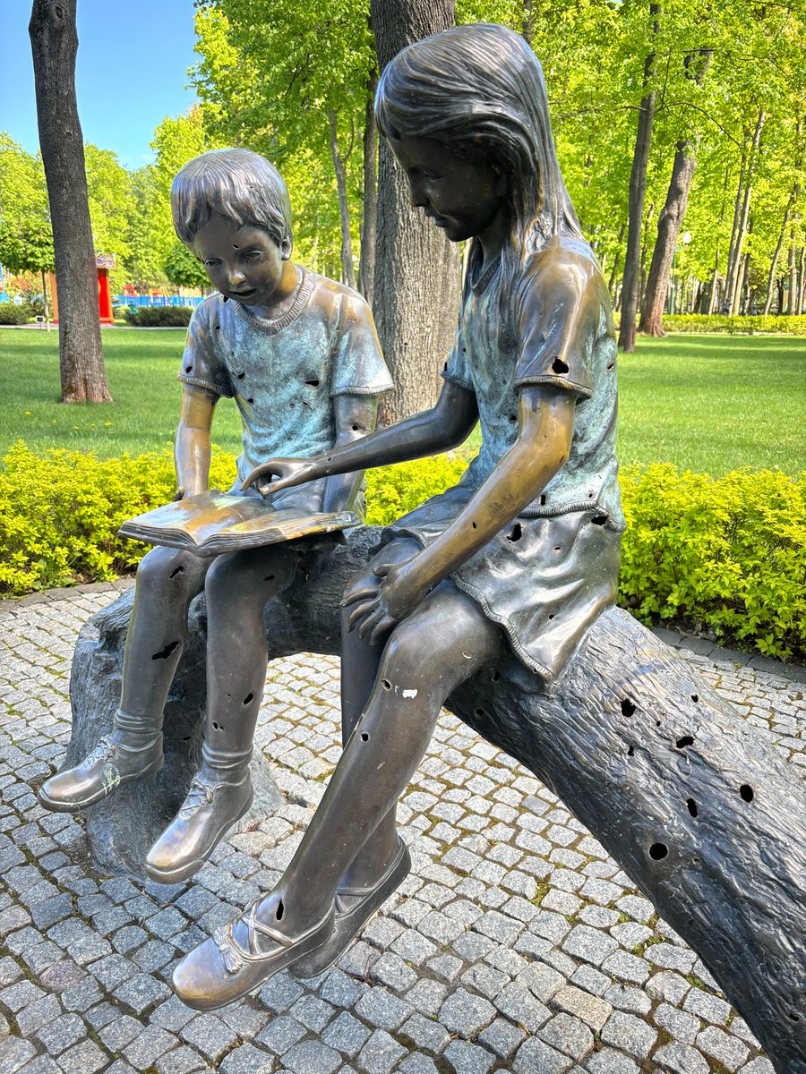 Look closer - and you'll see that this sculpture in #Kharkiv's park has been damaged by debris. As the 800-day mark of war approaches, it's a stark reminder of the children in #Ukraine, bearing visible and invisible scars of war. They need our protection and assistance.