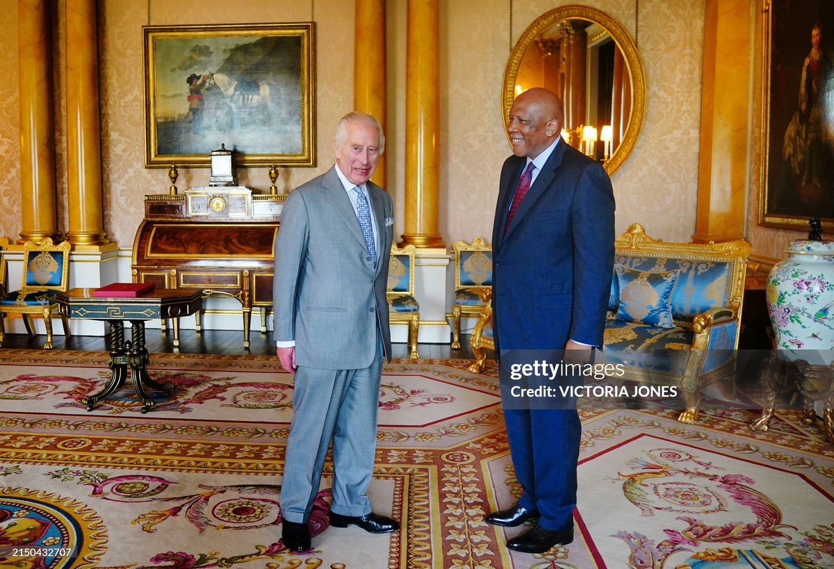 King Charles III greets Lesotho's King Letsie III during an audience at Buckingham Palace, in central London on May 1, 2024.