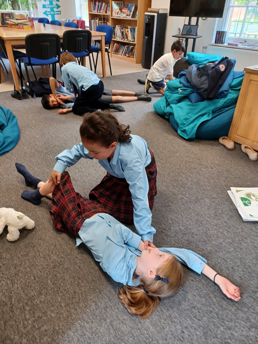 stgwindsor's tweet photo. At Junior Medics Club children are getting hands-on training with important elements of First-Aid, such as how to apply bandages and plasters and practising other life-saving skills. #firstaid #recoveryposition https://t.co/CGKeodMI9R