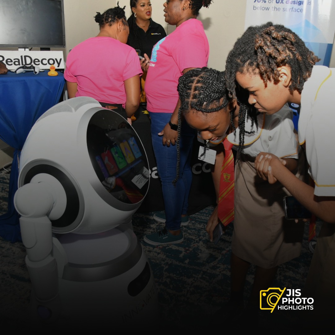 #JISPhotoHighlight: Turing Test? Testing 1.2.3... Kourteney Rochester and Crysanta Whyte faced off against a robot in a thrilling battle of wits during the Flow Girls in ICT Day Expo on Thursday (April 25).