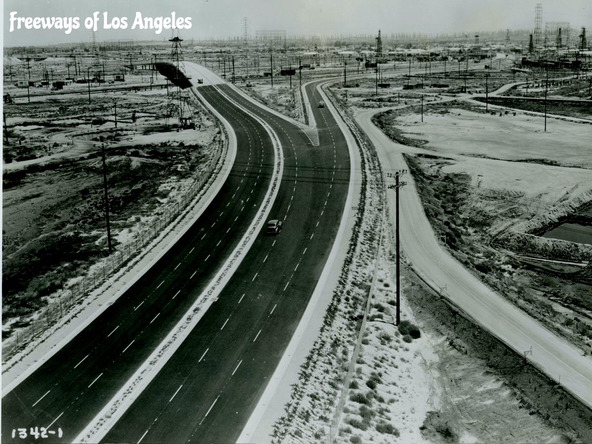 1949 - Looking NE over newly constructed Terminal Island Fwy (then CA-47, now CA-103) in Wilmington -- Bureau of Public Roads photo. Anaheim St/Union Pacific RR Viaduct at upper left. Off-ramp at right since closed but ghost remnants remain.