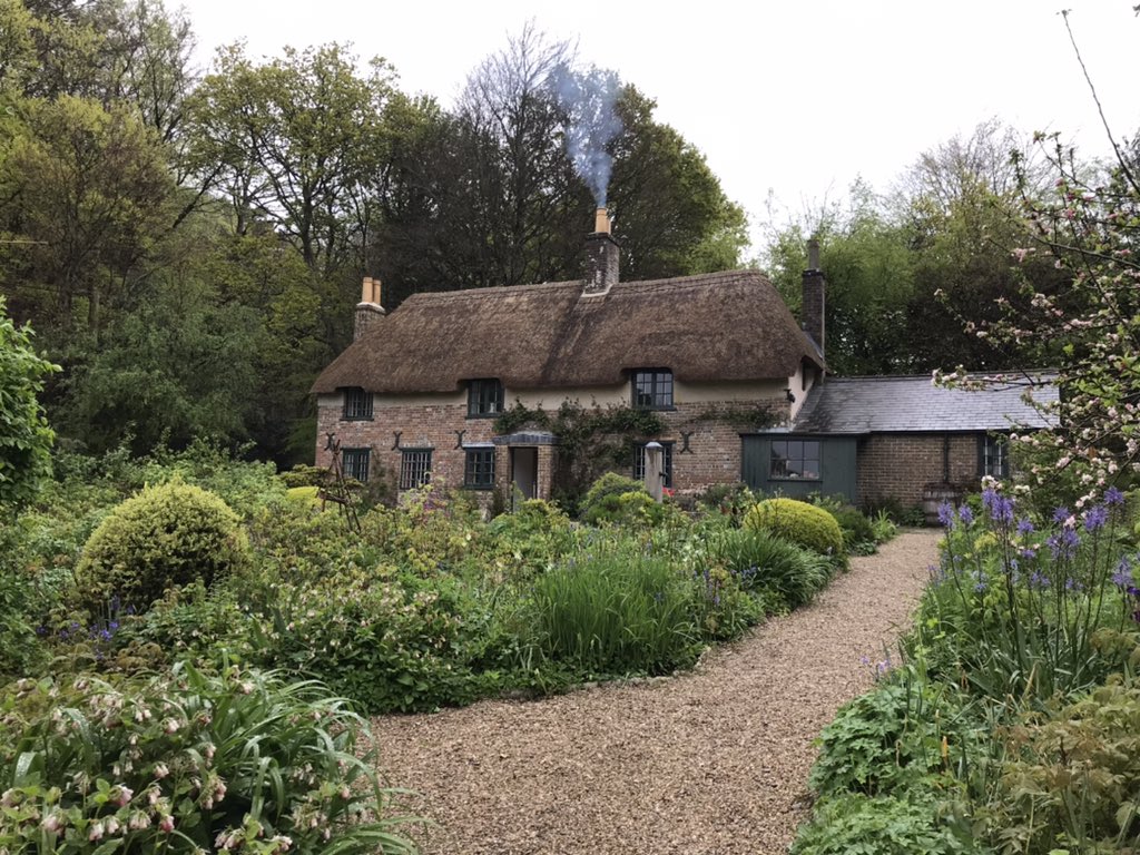 Thomas Hardy’s Cottage. He was born in the upstairs bedroom closest to the door, and wrote Far From The Madding Crowd in the room with the roses below the window.