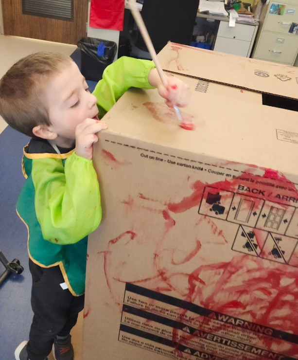 Our friend J. is working hard at painting. This box has been an imaginative play staple in Class Two this month. #learningthroughplay #FDK #SpecialEducation
