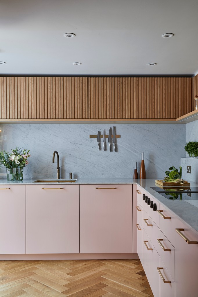 Dreamy Carrara marble meets soft pink painted cabinetry, complemented by our slatted wood Skog range. This kitchen isn't just beautiful—it's incredibly functional too! 💖✨ #KitchenGoals #FunctionalElegance #kitchendesign l8r.it/LBG6