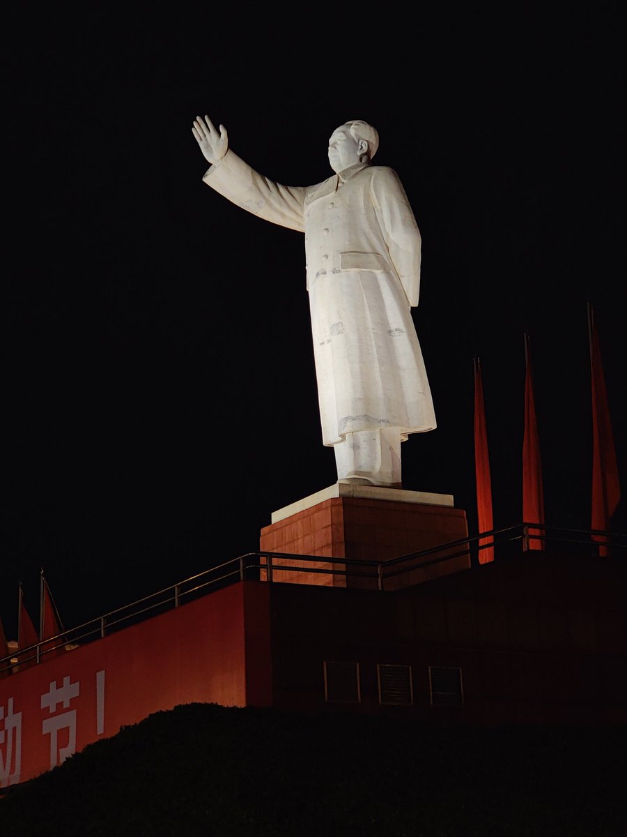 Mao statue at night