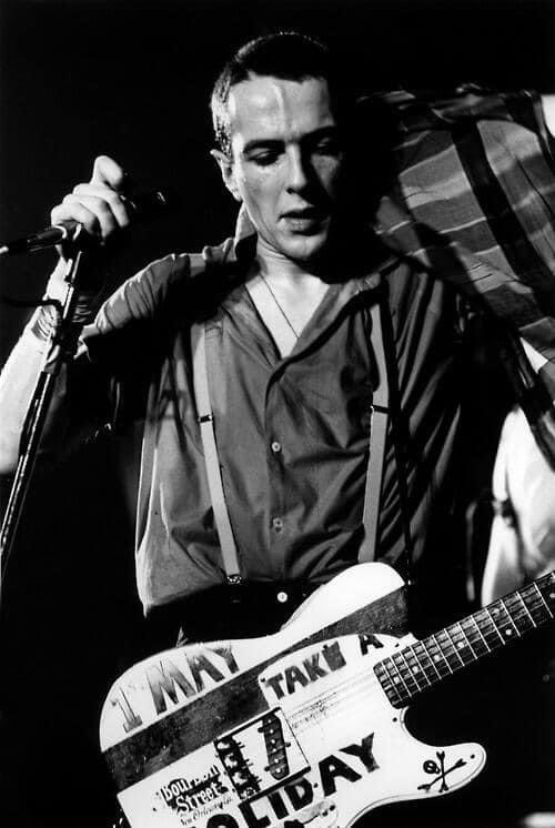 After the release of ‘London Calling’ a group of fans followed The Clash from city to city, hoping to convince the band to play a May Day benefit. Joe heard the fans out and taped “1st May take a holiday” to his guitar for the band’s US TV debut on ABC’s ‘Fridays’ show in 1980.