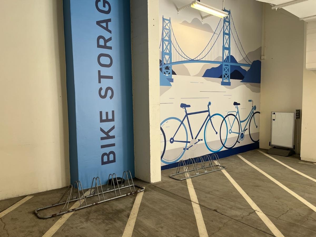 MTC spent a quarter billion dollars on their new office building. The budget for bike parking apparently included a great mural and $100 for two crappy Amazon bike stands.