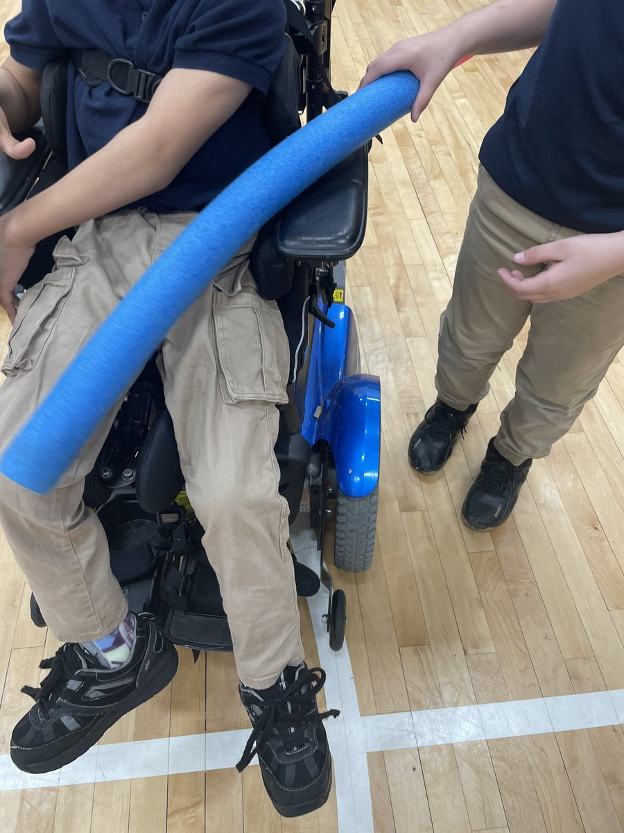 Working w/ an #AdaptedPE 🧑‍🎓 in the gym w/ the whole self-contained class. The focus has been working on fleeing & chasing w/ peers along w/ engaging w/ others to join. Break through today when the Gen Ed🧑‍🎓 helped the APE 🧑‍🎓 secure the noodle for tagging before fleeing.