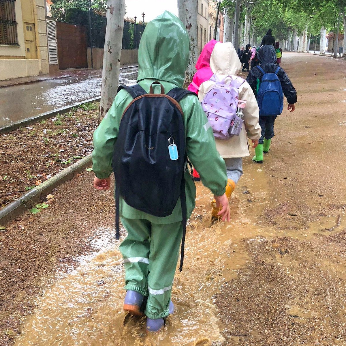 Rain or shine, embracing the elements! ☔️☀️ Outdoor play isn't just fun, it's crucial for kids' growth and wellbeing. Let's make memories together! #iscatschool #jumpinginpuddles #OutdoorPlay'