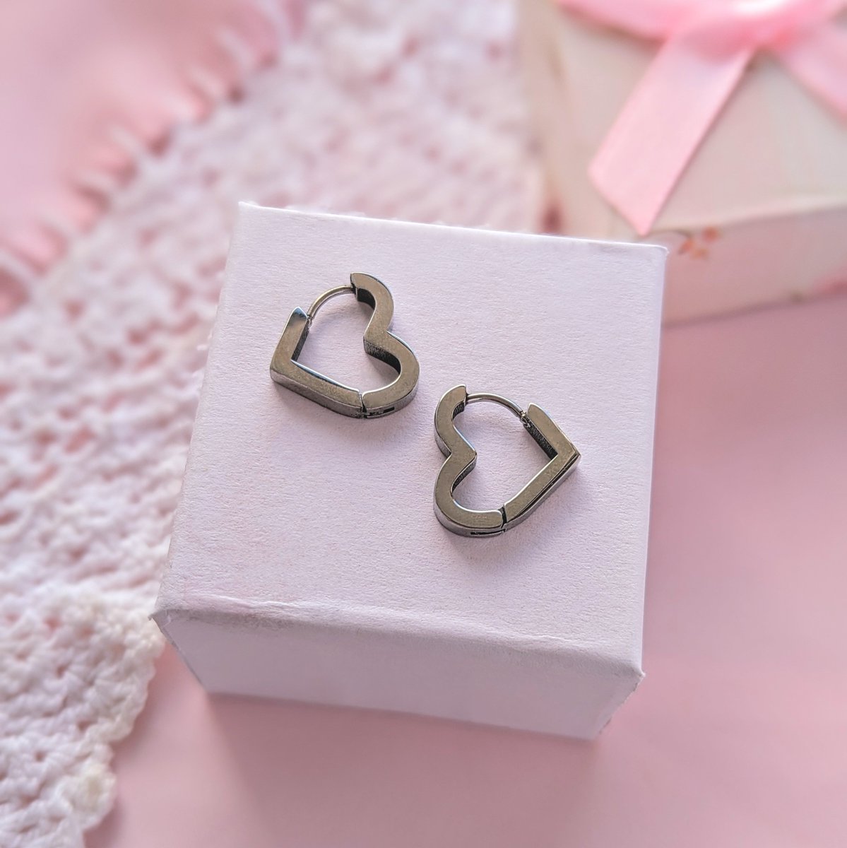 Orders on our site will receive a FREE pair of heart huggie earrings ☁️