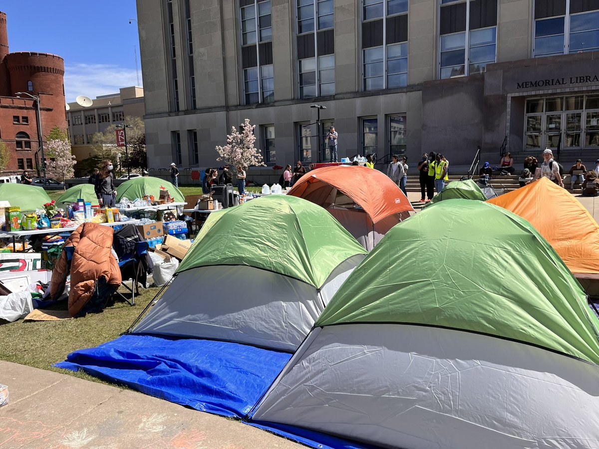 The tents are back up on Library Mall - with groups of police watching on the sidelines.