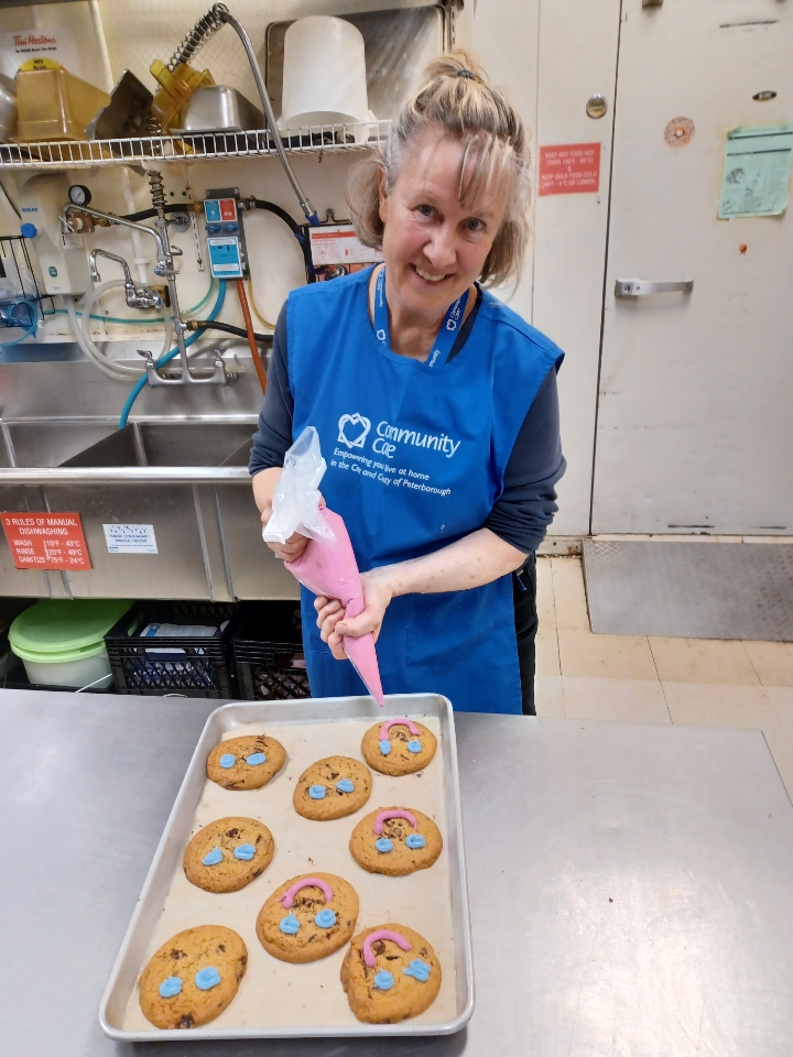 Our Board President, Janet Kelly, helped ice #SmileCookies today! Thank you, Janet, for your support of Community Care. @TimHortons #EverySmileCounts