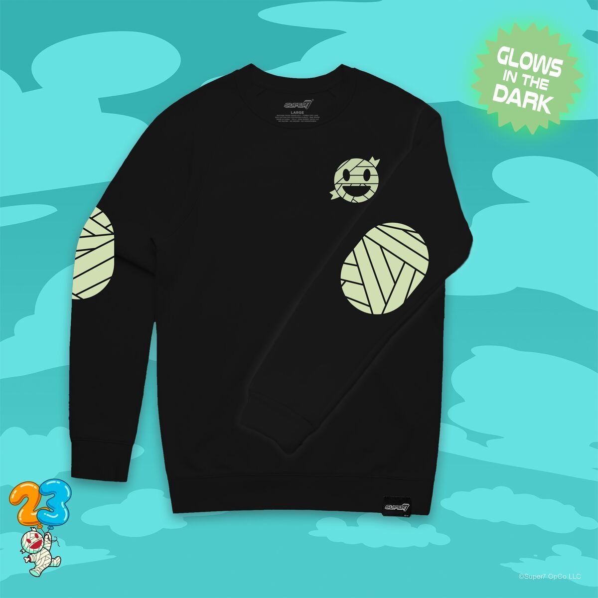 Celebrate Super7’s lovable mascot, Mummy Boy, with this fun yet sophisticated elbow patch crewneck! With our beloved Mummy Boy on the front, with bandage elbow patches on either arm - all screen printed in glow-in-the-dark ink! Pre-order now at Super7.com! #Super7