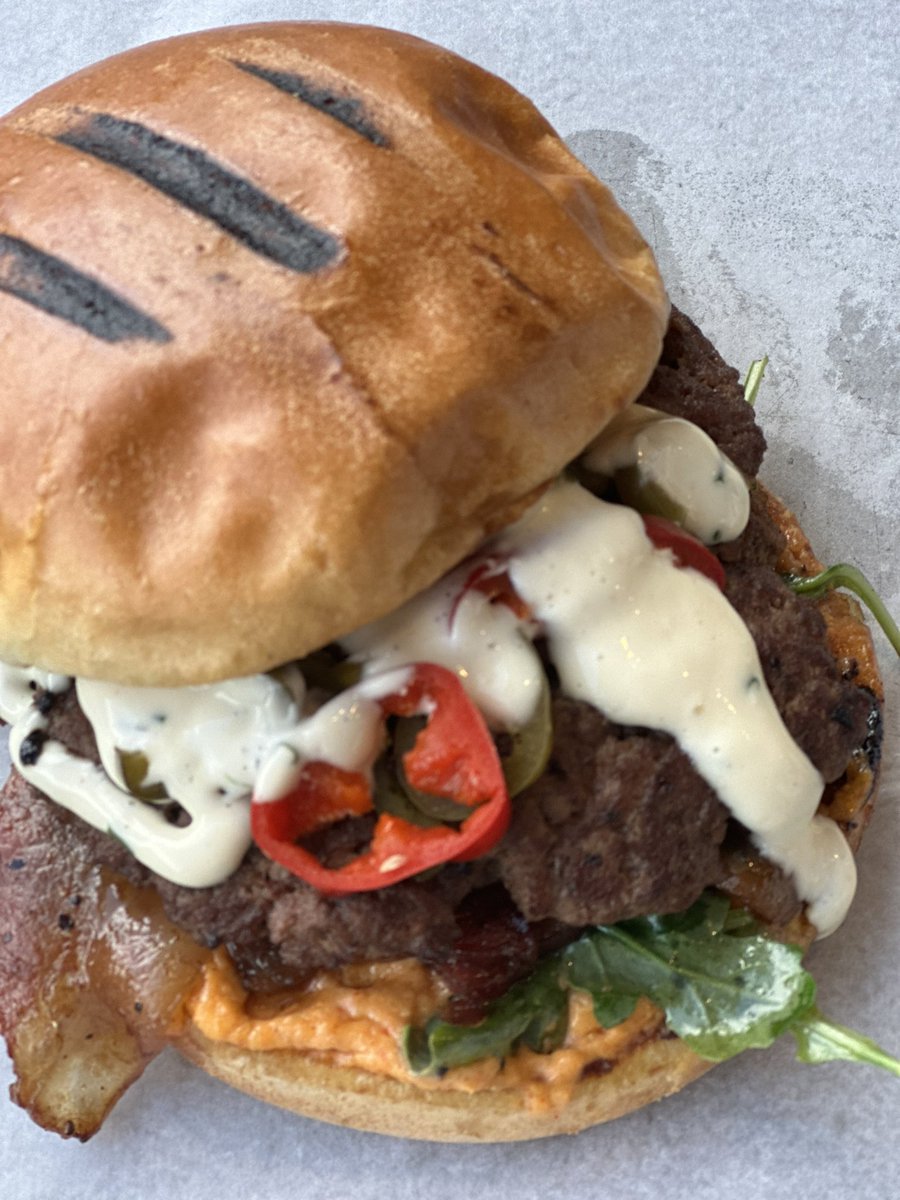 WEDNESDAY SPECIAL - The Pimento Piledriver Burger: Beef smash patty, pimento cheese, arugula, candied bacon, spicy peppers, chive aioli, on brioche OPEN NOW