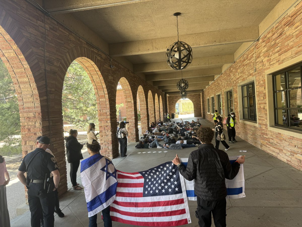 At CU Boulder, several dozen pro-Palestinian protesters are staging a “die in.” According to organizers, they’re not doing an encampment because Boulder’s culture wouldn’t support it. Counter protesters here as well.