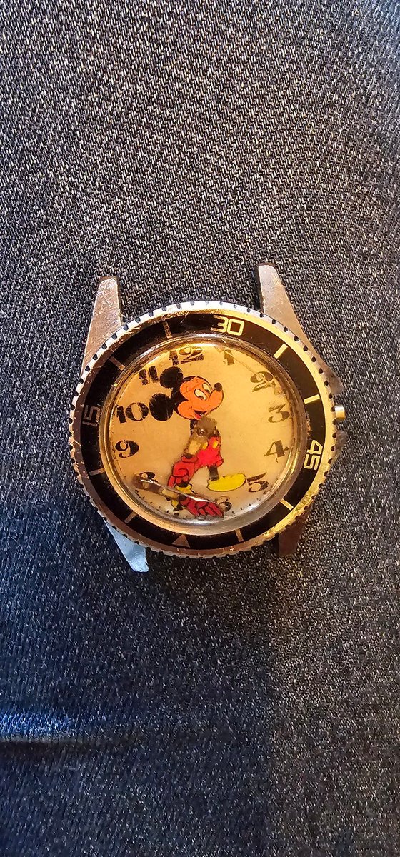 I have been looking through a box my Dad gave to me before he passed,I haven't looked through it until today and I've found this #Watch . It's in bad condition but can anyone tell me more about this please. #VintageWatch #MickeyMouse #Watches