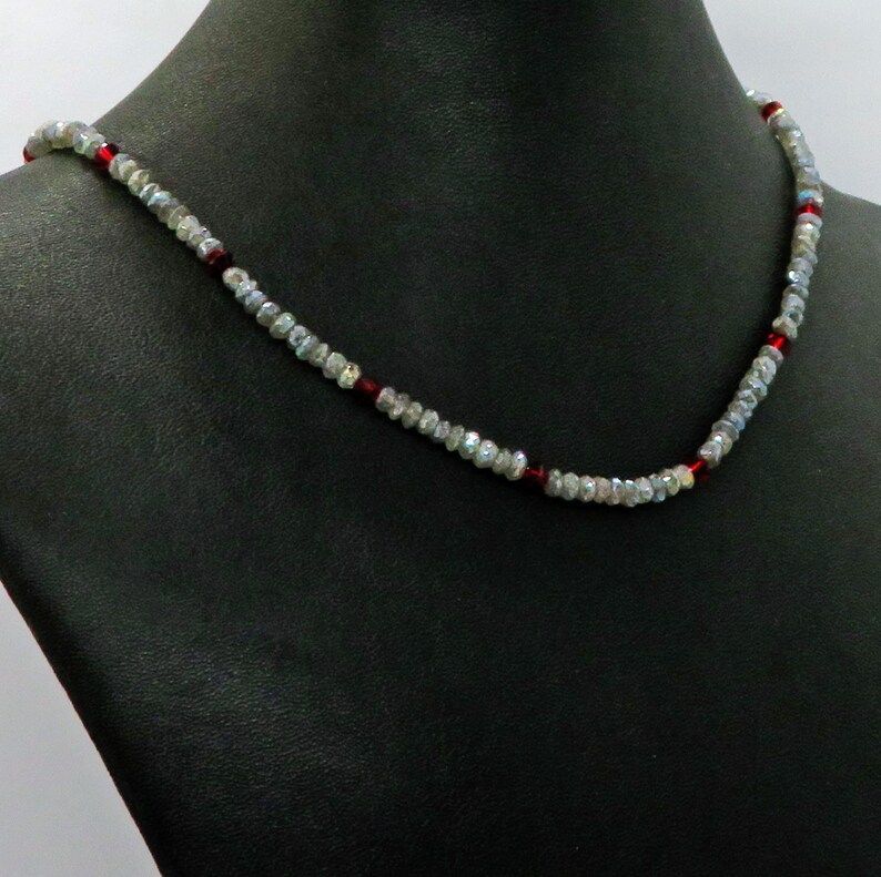 Labradorite and Swarovski Crystal Gemstone Necklace, perfect for making a statement. Featuring faceted Swarovski Crystals in grey and red hues. #GemstoneNecklace #SwarovskiCrystals buff.ly/3QLkJXV