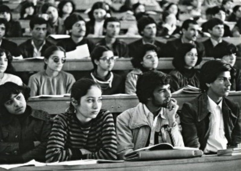 Students, young men and women, attending lecture at the Polytechnic of Kabul, Democratic Republic of Afghanistan in 1985. 
Back in the old socialist days, when women's rights were respected and significant social achievements were taken place.