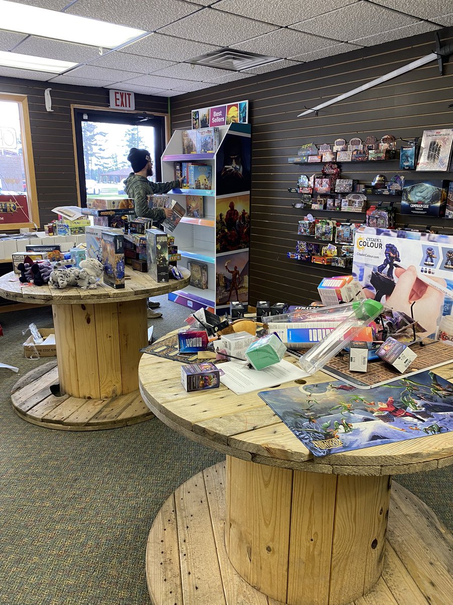Don’t mind our mess as we put together our new board game display!
