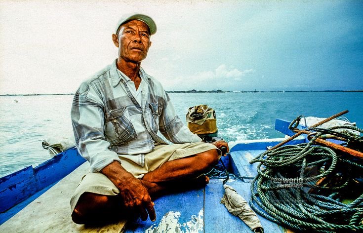 A Balinese fisherman in the waters off Tanjung Benoa, Bali, Indonesia. Gary Moore photo. Real World Photographs. #bali #indonesia #fisherman #malmo #sweden #canada #photojournalism #world #documentary #photography #garymoorephotography #realworldphotographs #nikon