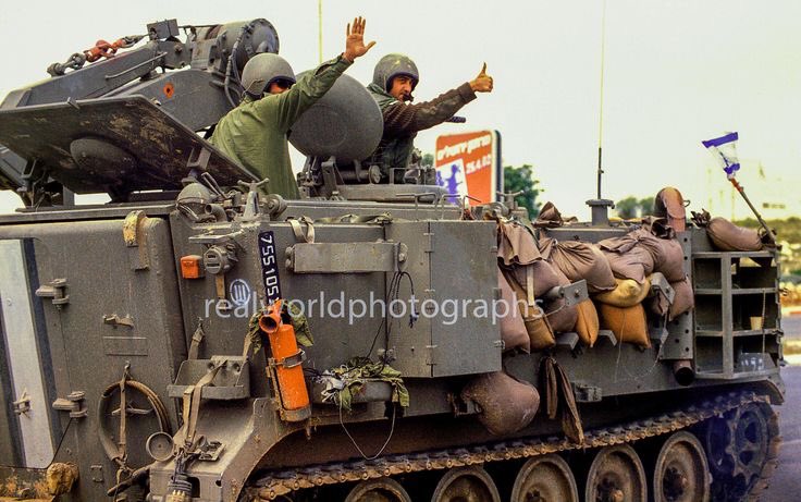 An Israeli soldier gives the thumbs up during Operation Defensive Shield in 2002. Jerusalem, Israel. Gary Moore photo. Real World Photographs. #war #conflict #israel #palestine #soldiers #tank #malmo #sweden #garymoorephotography #realworldphotographs #nikon #photojournalism